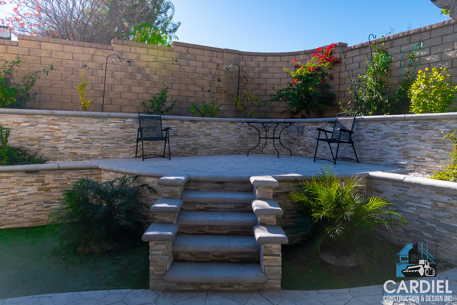 Remodeled backyard featuring a stylish patio cover, functional outdoor kitchen, and vibrant plants, perfect for entertaining and relaxation.